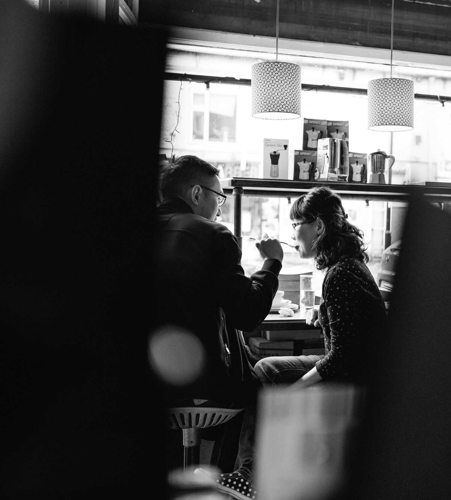 couple feed each other cake